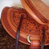 Half tooled Vaquero Lace with Daffodil flower Wade Saddle      
built on a 94 degree bar that fits a well built muscular shoulders -
The seat is finished at 15 & 1/2 inch with a close contact deep pocket fit -
Gullet is 7 & 1/2 inch height by 6 & 1/2 width with the back hand hole width at 4 inch -
Horn is 6 inch height by 5 and 1/2 inch width Guadalajara at 31 degree pitch - Cantle is 4 and 1/2 inch in height by 12 & 1/2 in width with a Cheyenne roll - Flat plate riggin at 7/8ths
- leather lined 5 inch Stainless Steel Moran Stirrups . 